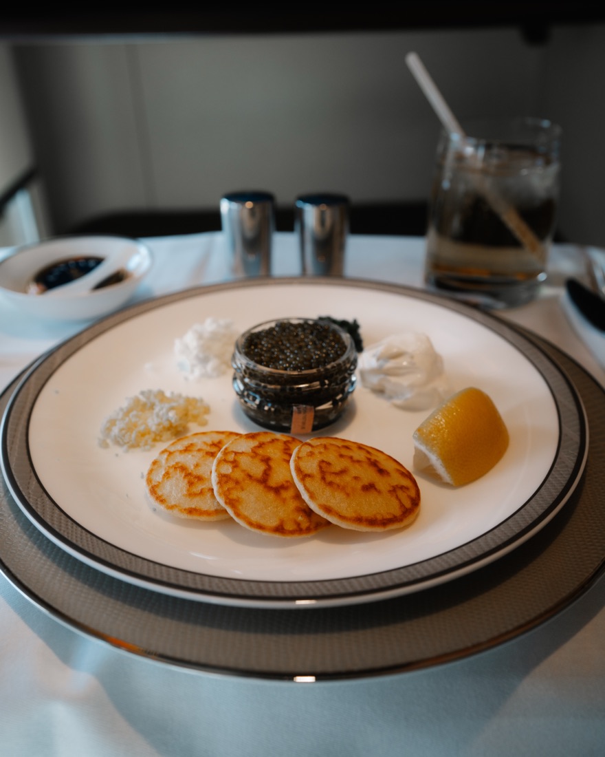 Caviar service with blinis on a white plate