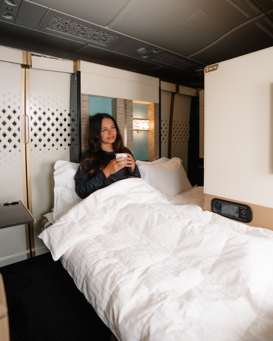 Catarina relaxing in an Etihad First Apartment with the bed made up
