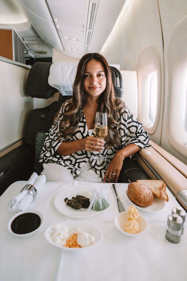 Catarina with champagne and dinner in Lufthansa First Class